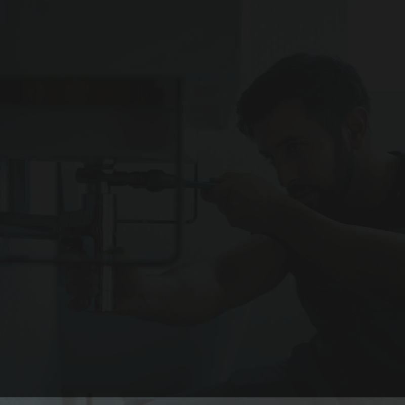 plumber-working-under sink